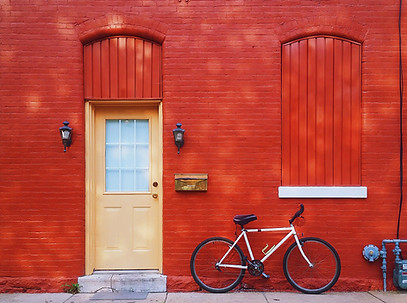 Bicycle Against a Red Wall