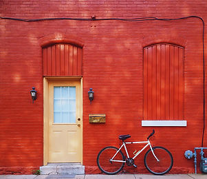Bicycle Against a Red Wall