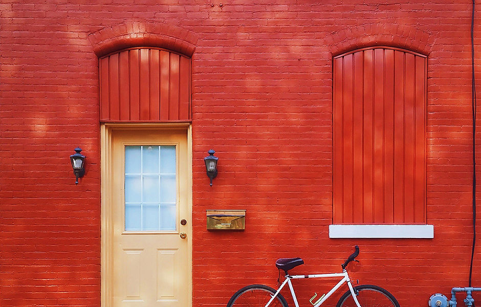 Bicycle Against a Red Wall