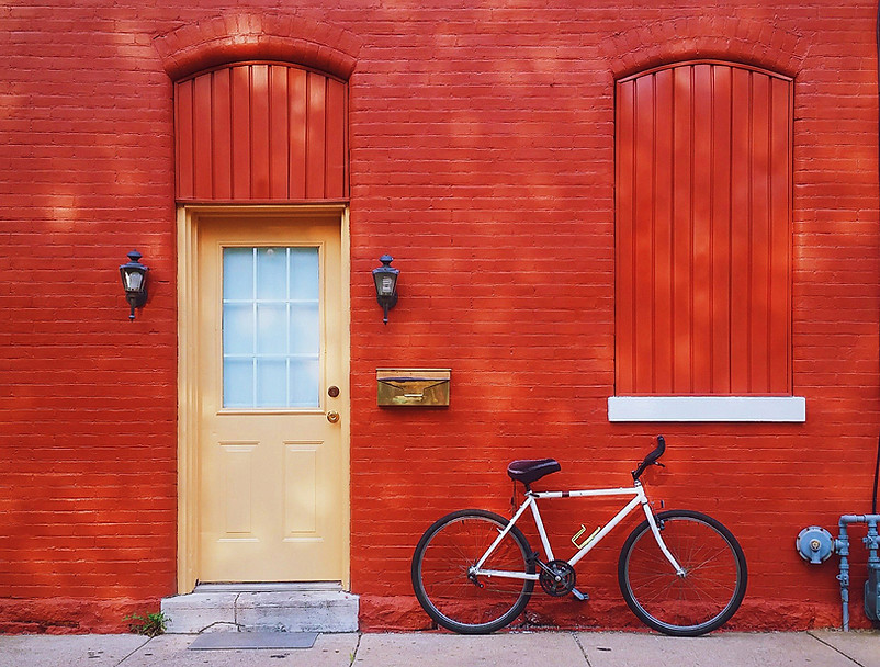 Bicycle Against a Red Wall