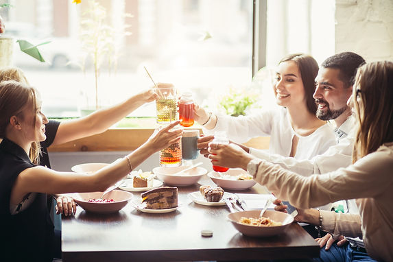 friends enjoying drinks at restaurant