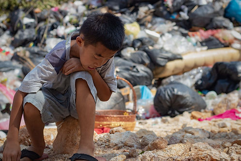 Child waste picker.AdobeStock_265662365.