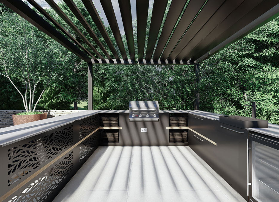 A luxurious outdoor kitchen set in a beautifully landscaped garden in Kent, designed for stylish entertaining and family gatherings. The large garden design features a modern pergola casting artistic shadows over a modern BBQ setup, complete with a built-in grill, sink, and fridge. Elegant laser-cut metal panels add a touch of sophistication, complementing the surrounding lush greenery and natural stone accents. This landscape garden design seamlessly blends functionality with high-end aesthetics, creating the perfect space for alfresco dining and relaxation