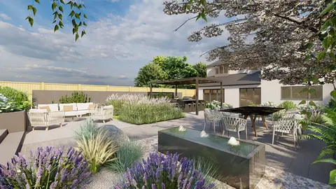 A luxurious contemporary garden with a large aluminium pergola and an outdoor kitchen. There is also a dark grey aluminium water feature with three fountains. The garden includes a Mediterranean gravel garden and a large dining table on a composite decking area.