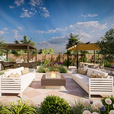 A large contemporary entertaining garden design in south east Lonon with a chequered board tile effect and two pergolas with an outside kitchen and dining table.