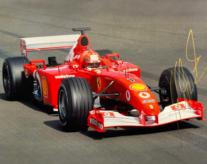 Michael Schumacher i sin klarröda Ferrari Formel 1 bil F399 från 2001.