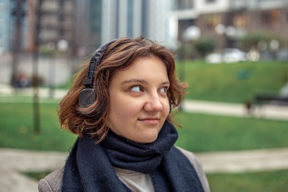 teenage-girl-listening-music-headphones-city-woman-city.jpg