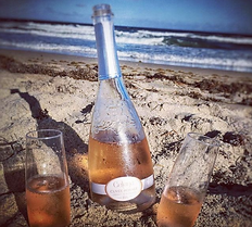 Cuvée Royale on the beach.png