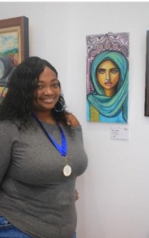 Mionne McKenzie with her piece Unveiled Strength