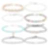 Collection of various anklets, including shells and colorful beads, on a white background.