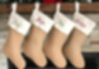 Four stockings hang: labeled Dad, Mom, Jan, and Carter, by the fireplace.