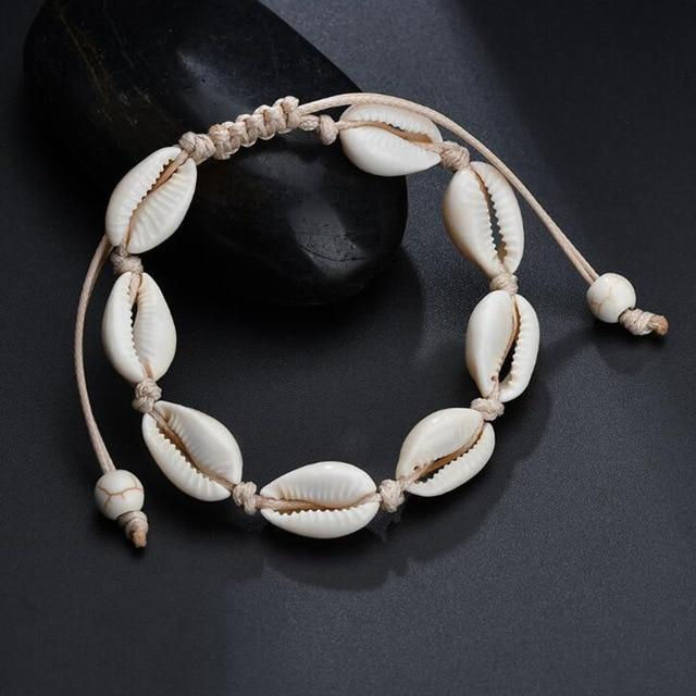 Thumbnail: White seashell bracelet on a dark background, beach style jewelry.
