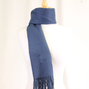 Thumbnail: A blue scarf displayed on a mannequin, with a fringed bottom, and folded.