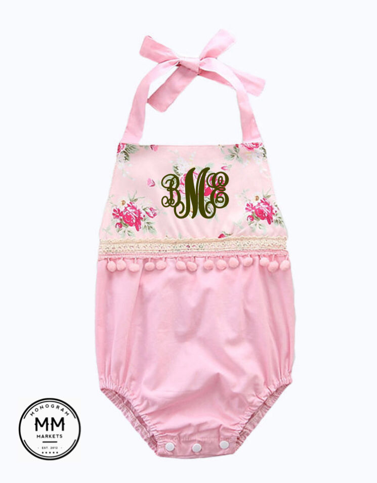 Thumbnail: Pink baby romper with floral design and MM initials, lace trim.