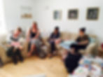 Students learning Breastfeeding, bottlefeeding, and lactation skills at a postnatal doula training program.