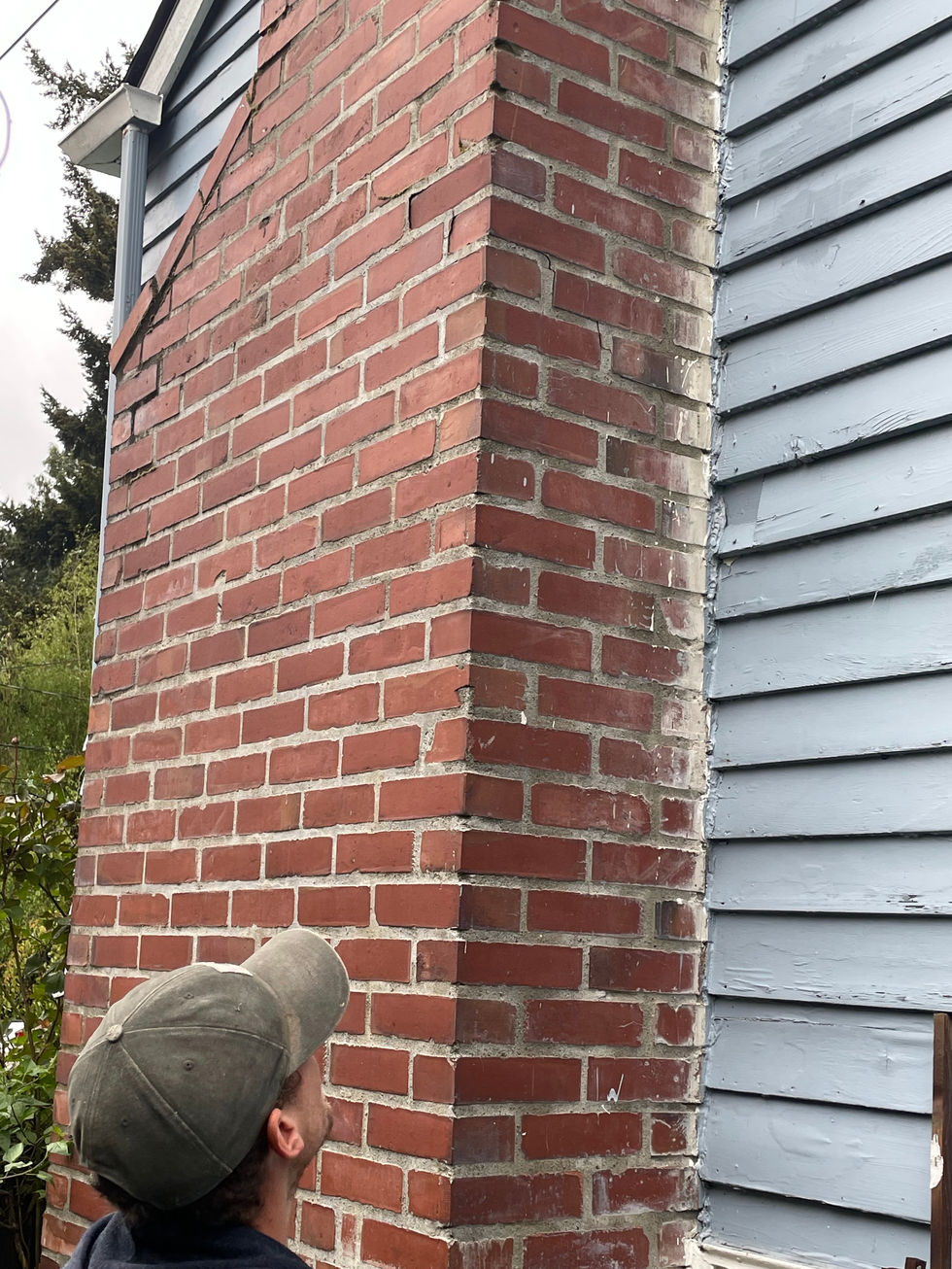 Inspecting mortar joints and brick faces and separation from home
