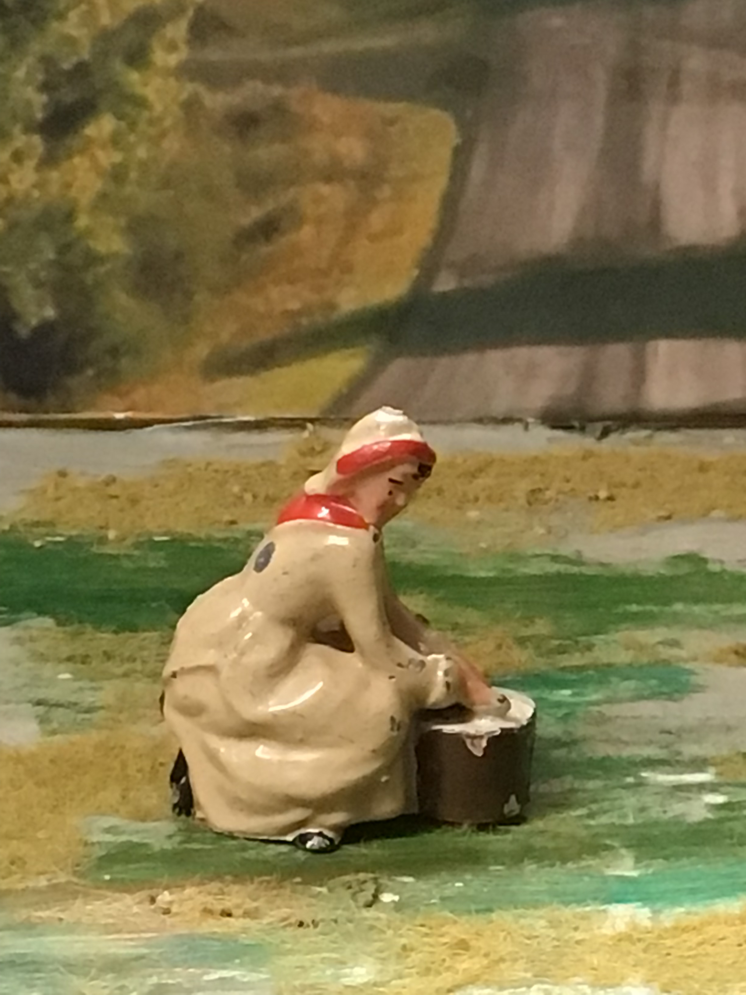 Britain's 54mm hollow-cast lead milkmaid seated milking with pail