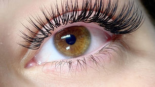 Close-up of eyelash extensions being applied