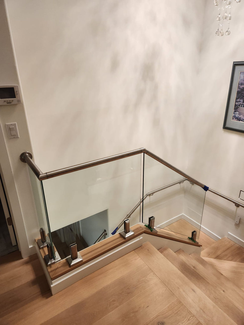 glass-stair-railing-with-wood-flooring