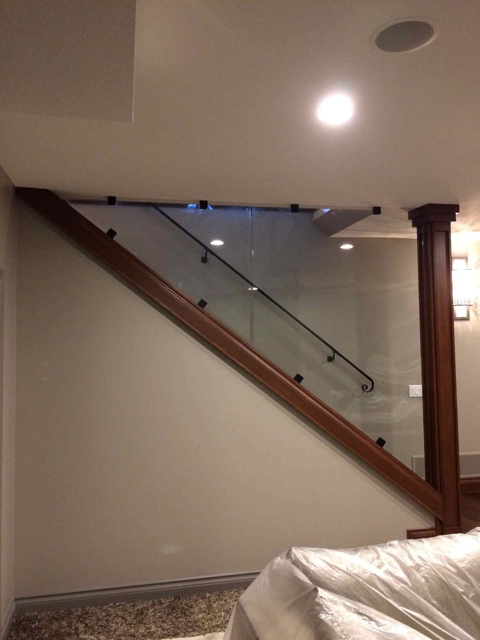 custom-glass-stair-railing-with-wood-handrail