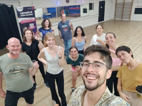 A group photo of trainees at the salsa studio in Jerusalem.