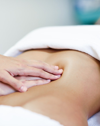 hands-massaging-female-abdomen-therapist-applying-pressure-belly.jpg