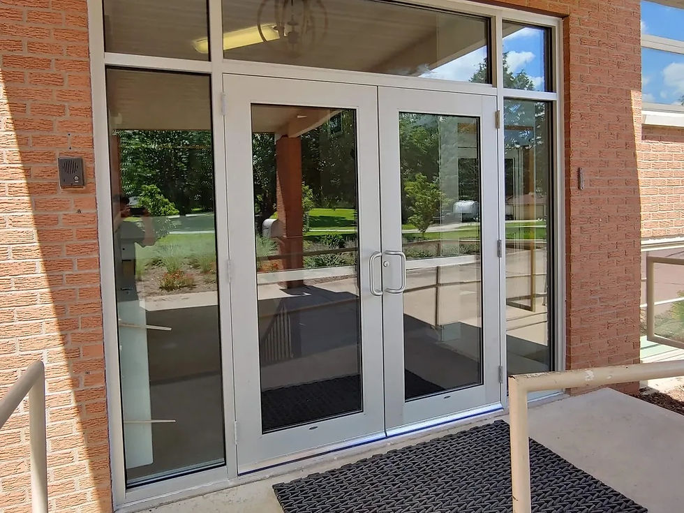Commercial doors at a brick building entrance