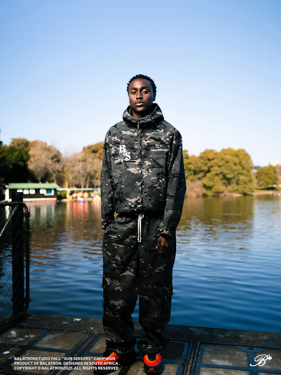 Model Tumelo Agbohla wearing the V1 shell jacket and V1 camo cargo pants. Photo: Zed Armani