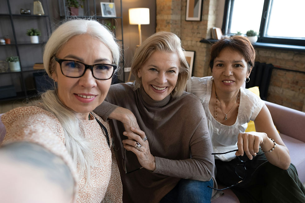 A circle of women travelers laughing and connecting during a small group tour.