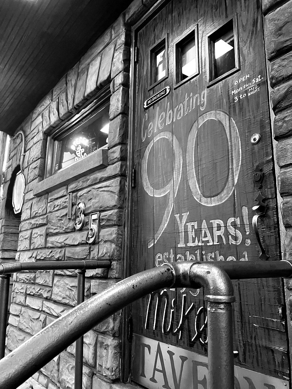 A warm glow emitting from the title: "Mike's Tavern'