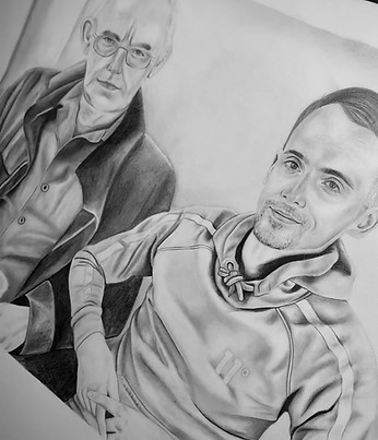 Graphite drawing of two people sitting next to each other, smiling at the camera.