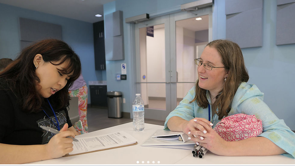 Volunteer Cha Yong Patterson interviewing Lauren Bellieu about her takeaways from JEE.