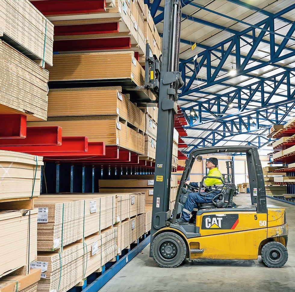 Forklift moving wood panels in a warehouse for Cabbie Connect