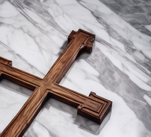 wooden cross lying on marble.jpg