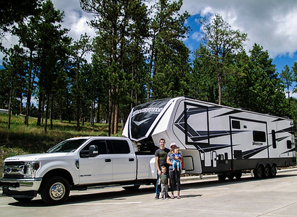 photo of family with their 5th wheel RV