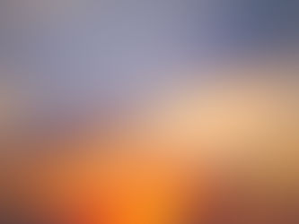 Golden rays burst through the clouds as the morning sun rises