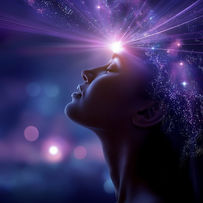 A serene figure in profile, with beams of light radiating from their forehead