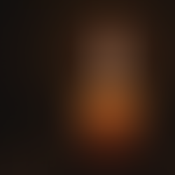 A single candle flame glowing softly in darkness, symbolizing inner light and spiritual awakening