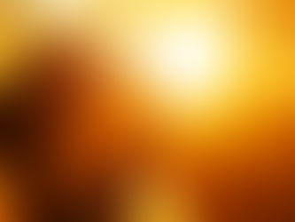 Woman with closed eyes smiling in warm sunlight