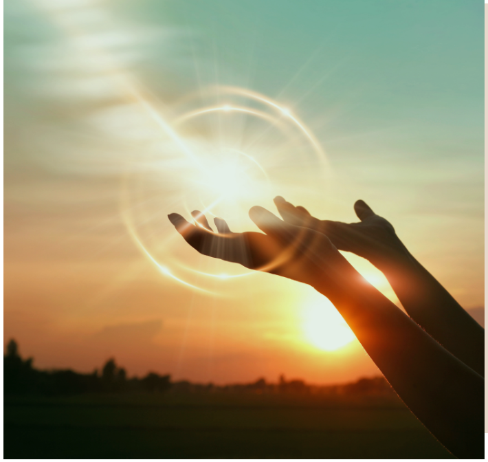 Hands reaching for the sunlight symbolizing hope and faith