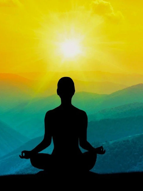 A silhouette meditates at sunrise, embodying tranquility and balance in the serene embrace of nature, reflecting the principles of Ayurveda and inner harmony.