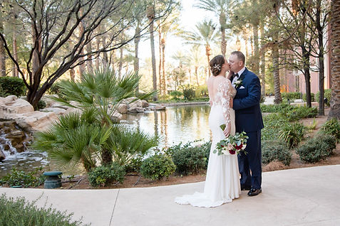 Bride and Groom beside pond.