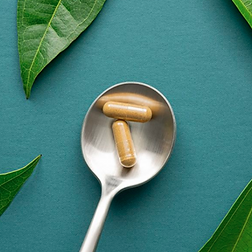 CAPSULES IN SPOON.png