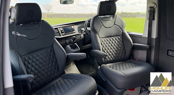 Cab interior of VW T6.1 Highline showing diamond-stitched leather captain's seats and dashboard