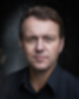 A headshot of Tim Beckmann
