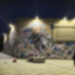 Parede com grafite em Lugano a noite.