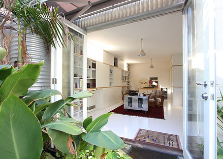 Studio house is an extension and reconfiguration of an existing studio space attached to a house in a former industrial building. ABA added a second storey  bedroom wing over the existing studio and reformatted circulation and storage. Sliding panels were used as a theme throughout the new rooms serving multiple functions such as window block-out shutters and allowing adaptation of the spaces to display services or collections, and use the space in multiple different ways.

The energy performance of the building was upgraded with stack ventilation and good cross-flow ventilation, double glazed windows and the addition of a large rooftop solar photovoltaic array. External shading is provided to windows via appropriately-sized eaves and adjustable folding arm blinds. 