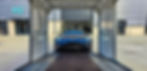 Blue sports car on trailer