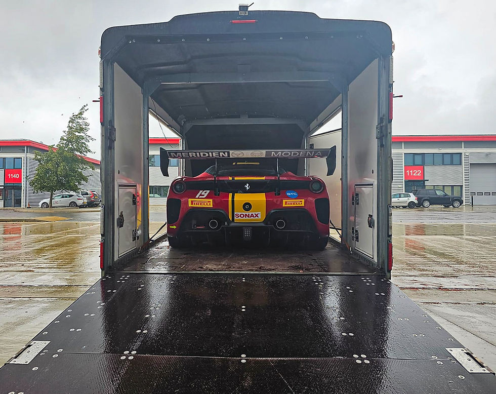 Red sports car on trailer