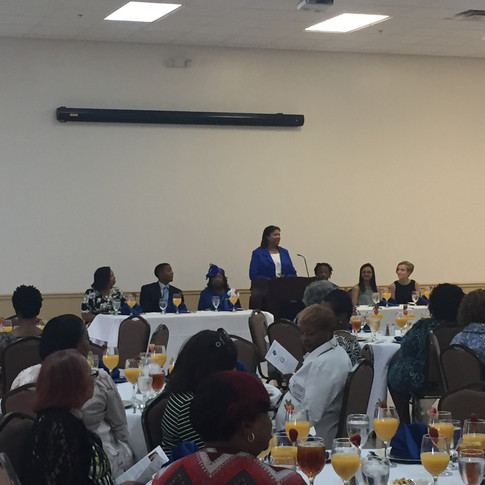Scholarship committee chair, Soror Cassandra DeMello addressing the luncheon attendees